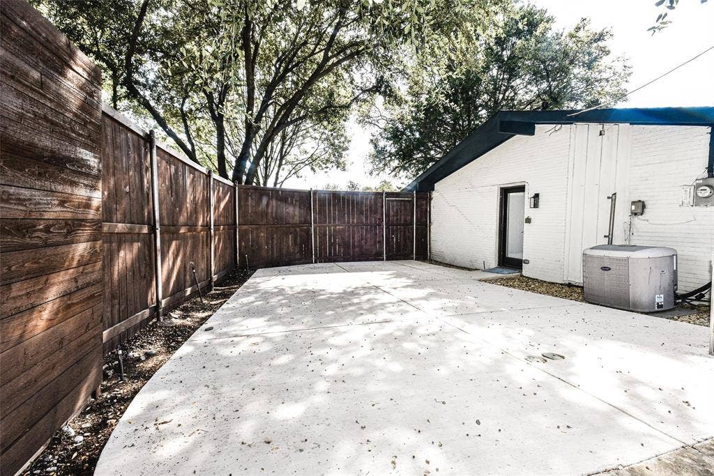 13936 Tanglewood Place, Farmers Branch, TX 75234 Private rear Sport-court ! Whether you game is basketball, pickleball or just riding the tricycle around - great play-space featuring a concrete patio, stained wood privacy fencing, and exterior brick masonry