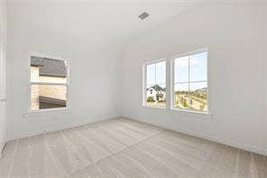 15638 Kestrel Mews, Frisco, TX 75035 Vaulted ceilings with neutral-toned carpeting and abundant natural light from multi-pane windows