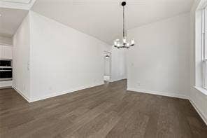 15638 Kestrel Mews, Frisco, TX 75035 Interior area featuring wood-finish flooring, a contemporary multi-light chandelier, and large window