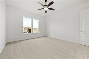 15638 Kestrel Mews, Frisco, TX 75035 Neutral-toned carpeting, dual-pane windows, a multi-blade ceiling fan with integrated lighting, and a solid-core interior door