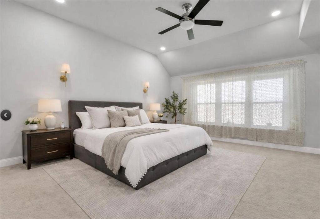 102 Champion Drive, Wylie, TX 75098 Vaulted ceilings, neutral wall-to-wall carpeting, recessed lighting, multi-blade ceiling fan, and dual wall-mounted light fixtures