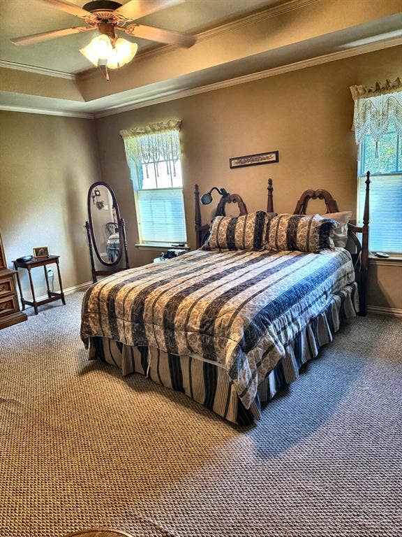 9031 Mallard Way, Larue, TX 75770 Tray ceiling featuring a central multi-blade ceiling fan with integrated lighting