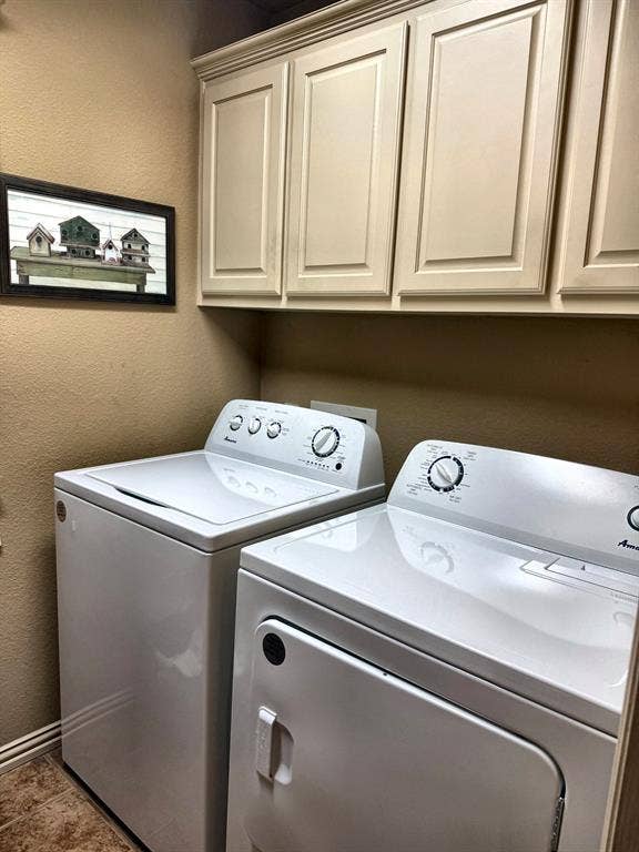 9031 Mallard Way, Larue, TX 75770 Custom-built cabinetry featuring raised-panel doors and neutral finish, paired with stone-textured flooring