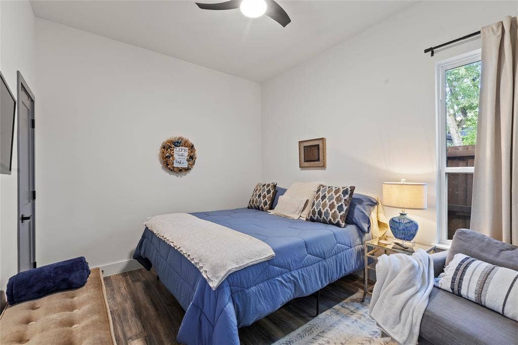 6113 Ottawa Trail, Mabank, TX 75156 Interior space featuring wood-finish flooring, high ceilings, a contemporary ceiling fan, and a single-hung window with a neutral curtain rod