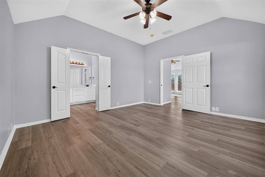 701 Abbey Lane, Midlothian, TX 76065 Vaulted ceilings, wood-finish flooring, and a ceiling fan with integrated lighting