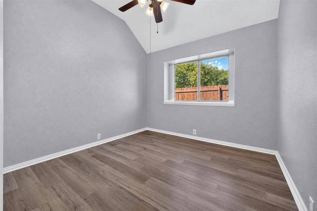 701 Abbey Lane, Midlothian, TX 76065 Vaulted ceiling, wood-finish flooring, and a multi-light ceiling fan