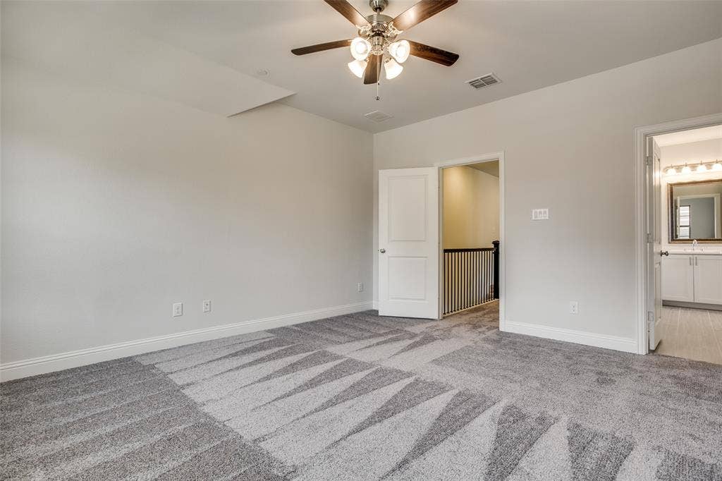 6341 Fortuna Lane, McKinney, TX 75070 Room featuring neutral wall tones, plush wall-to-wall carpeting, and a multi-light ceiling fan