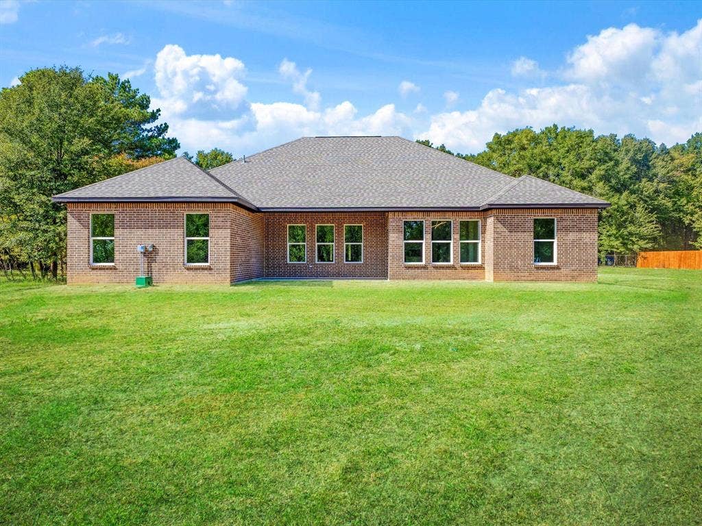 475 Loren Boyd Road, Combine, TX 75159 Brick exterior, architectural shingle roof, and expansive lawn area