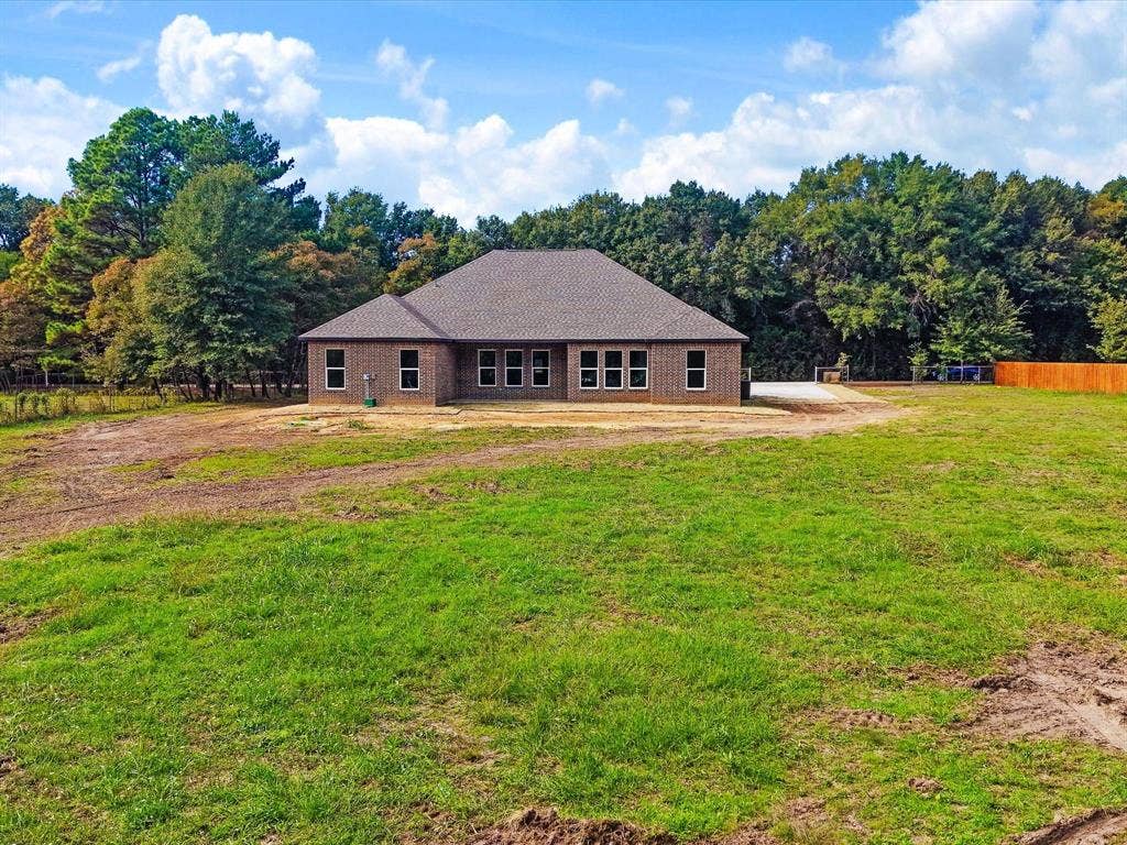 475 Loren Boyd Road, Combine, TX 75159 Single-story brick exterior featuring a hip roof, multi-pane windows, and an expansive rear acreage lot