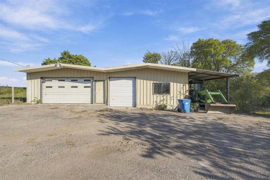 830 Truman Circle, Lancaster, TX 75146 Workshop with electric. RV parking where tractor is now parked