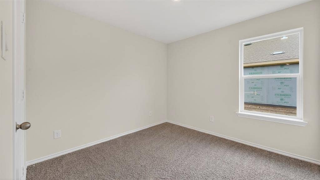 2825 Selfridge Lane, Forney, TX 75126 Neutral wall paint, plush carpet flooring, recessed ceiling lighting, and a single window