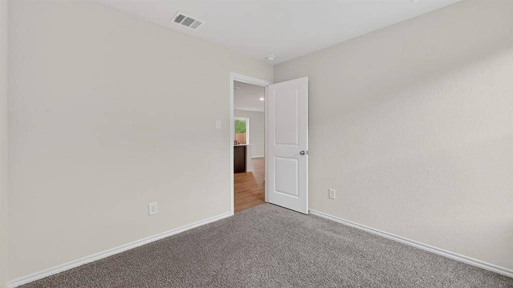 2825 Selfridge Lane, Forney, TX 75126 Neutral wall color, wall-to-wall carpeting, white interior door, recessed lighting