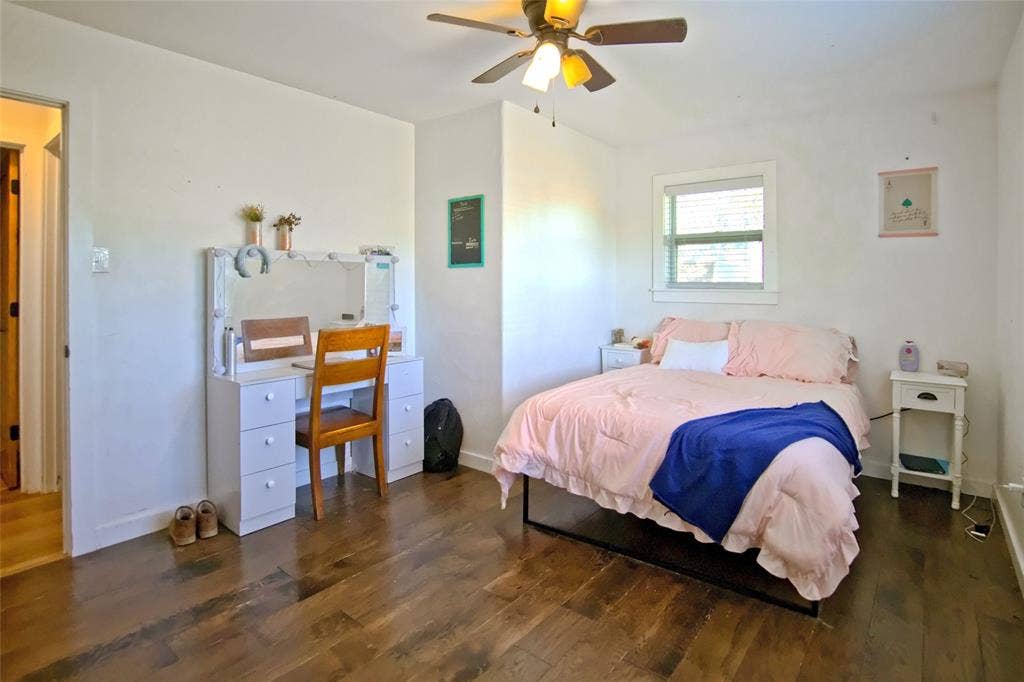 325 & 321 Grassy Way, Elm Mott, TX 76640 Wood-finish flooring, multi-light ceiling fan, and window with white trim