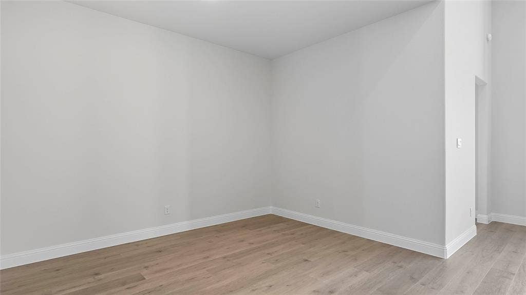 Neutral-toned walls and wood-finish flooring