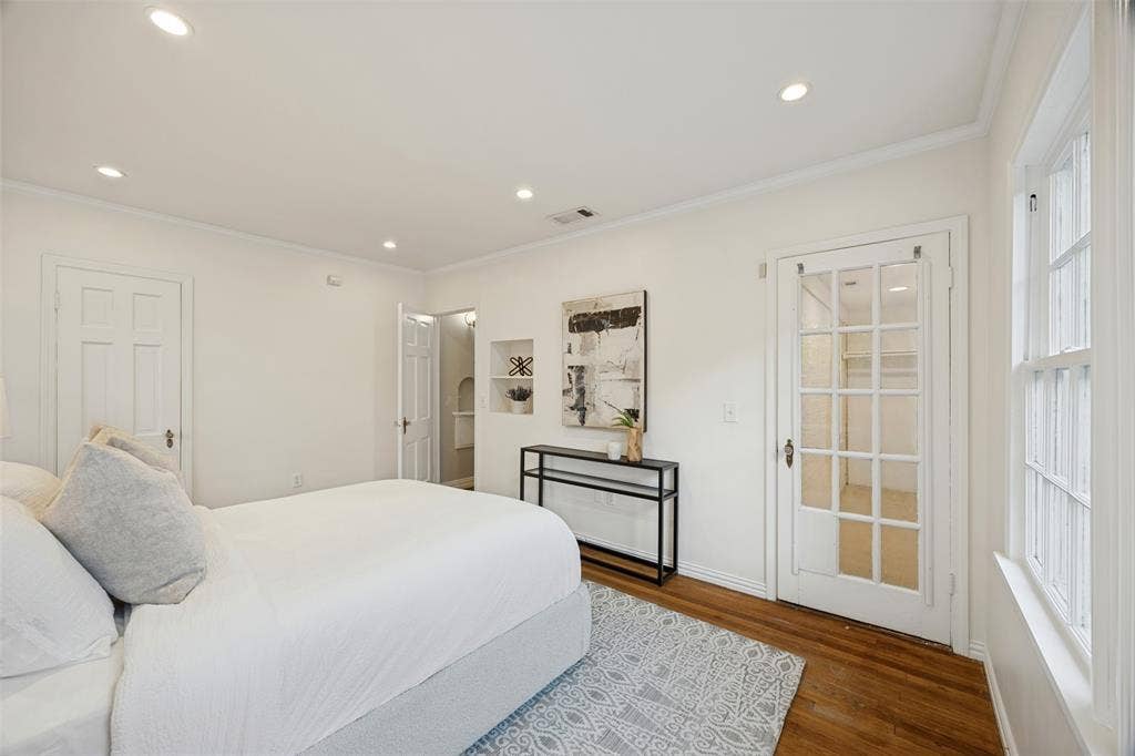 7011 Hammond Avenue, Dallas, TX 75223 Hardwood flooring, recessed lighting, built-in wall niche, and French door with glass panes