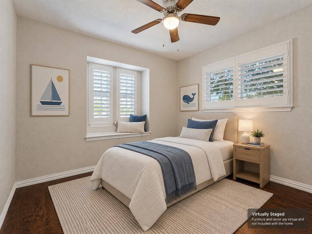 900 Lexington Drive, Plano, TX 75075 Bedroom featuring wood-finish flooring, recessed window nook, white plantation shutters, and a ceiling fan with integrated lighting