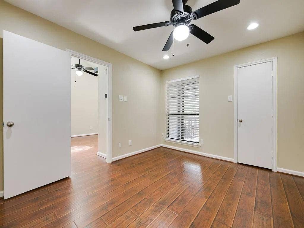 7525 Holly Hill Drive, #20, Dallas, TX 75231 Wood-finish flooring, ceiling fan with integrated light fixture, recessed lighting, and horizontal window blinds