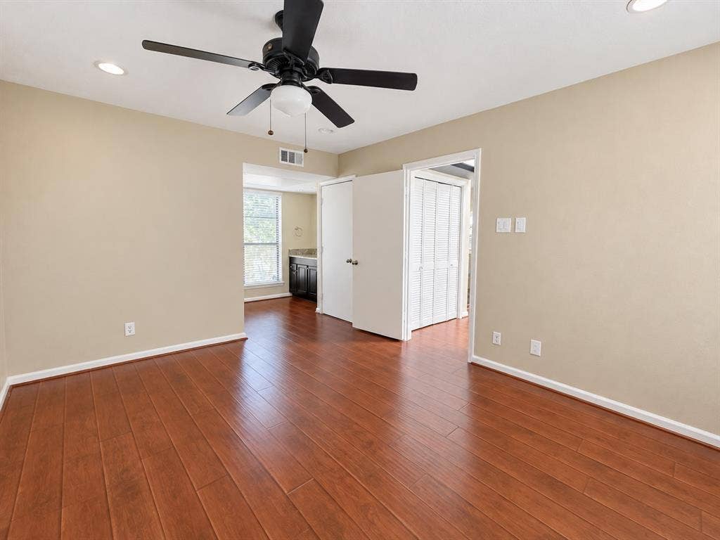 7525 Holly Hill Drive, #20, Dallas, TX 75231 Room featuring wood-finish flooring, recessed lighting, and a multi-blade ceiling fan with a central light fixture
