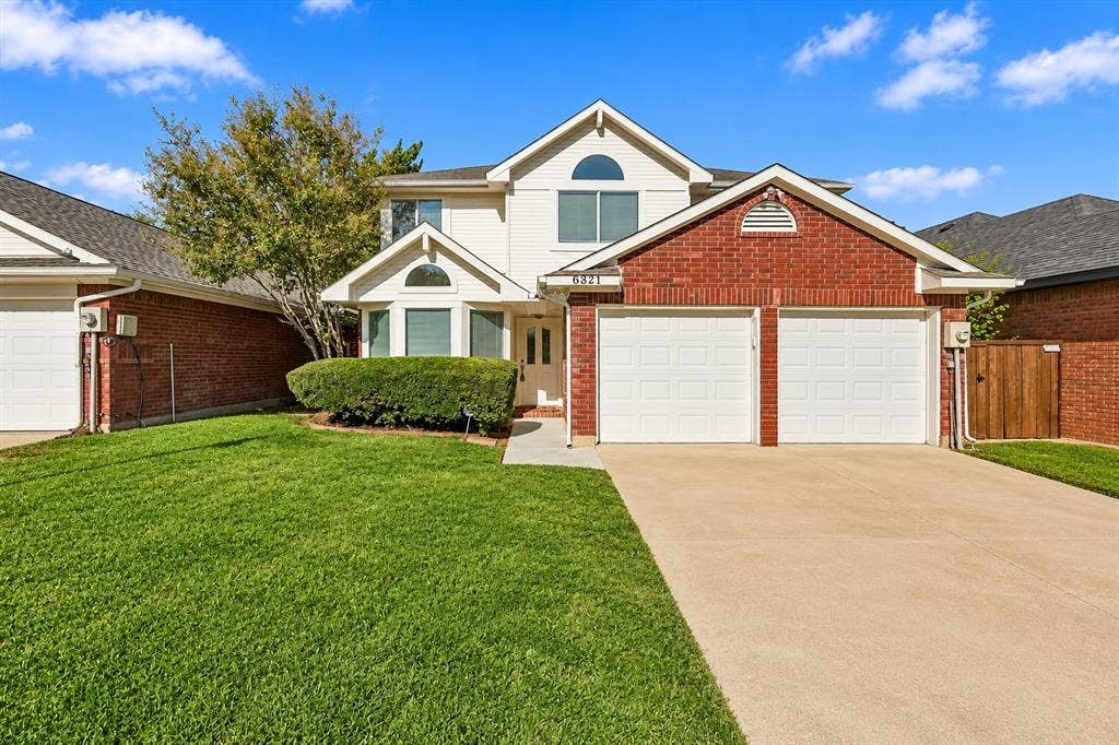 6821 Douglas Creek, Plano, TX 75023 Two-story residence featuring a brick and siding exterior, a concrete driveway, a double-car garage, and a front-facing bay window