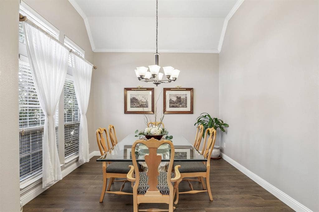 676 Princeton Way, Rockwall, TX 75087 Large dining room with vaulted ceiling, wood-finish flooring, and multi-light chandelier fixture