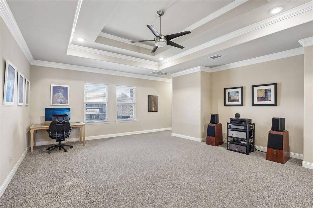 676 Princeton Way, Rockwall, TX 75087 Second floor living room featuring tray ceiling featuring crown molding and a center-mounted ceiling fan with integrated lighting, recessed lighting, and carpeted flooring