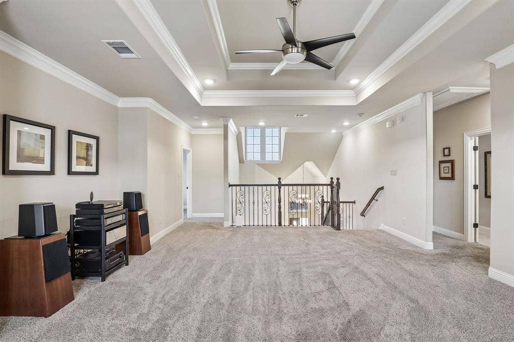 676 Princeton Way, Rockwall, TX 75087 Second floor living room featuring tray ceiling featuring crown molding and a center-mounted ceiling fan with integrated lighting, recessed lighting, and carpeted flooring