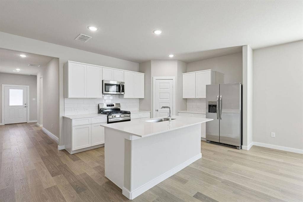 1943 Paddock Lane, Seagoville, TX 75159 Kitchen in the Holden home plan – REPRESENTATIVE PHOTO