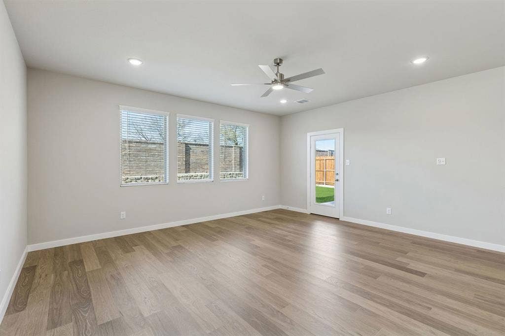 1943 Paddock Lane, Seagoville, TX 75159 Living Room in the Holden home plan – REPRESENTATIVE PHOTO