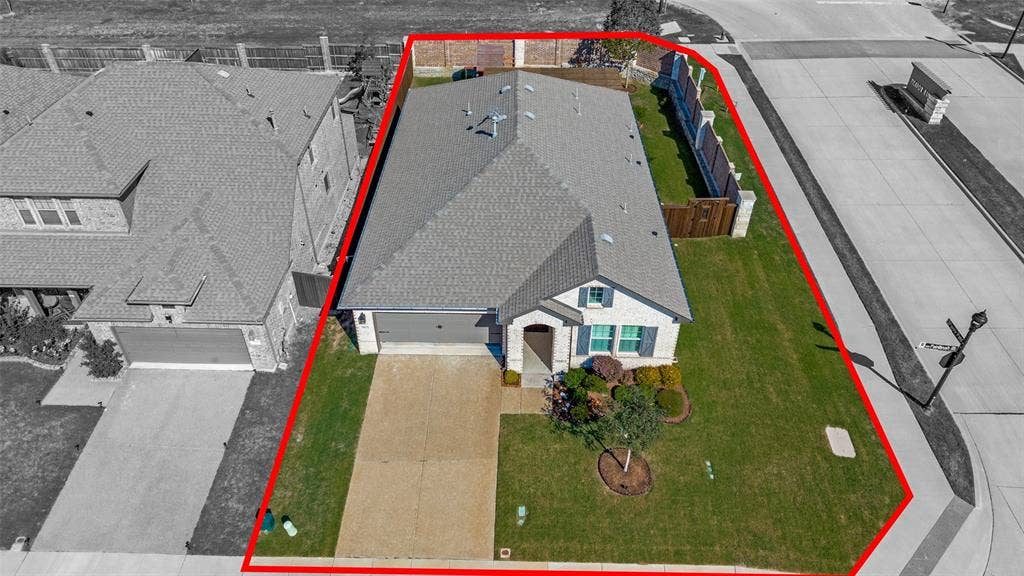 3417 Paintbrush Path, Melissa, TX 75454 Single-story brick exterior residence featuring a composite shingle roof, attached garage, concrete driveway, and a fenced backyard