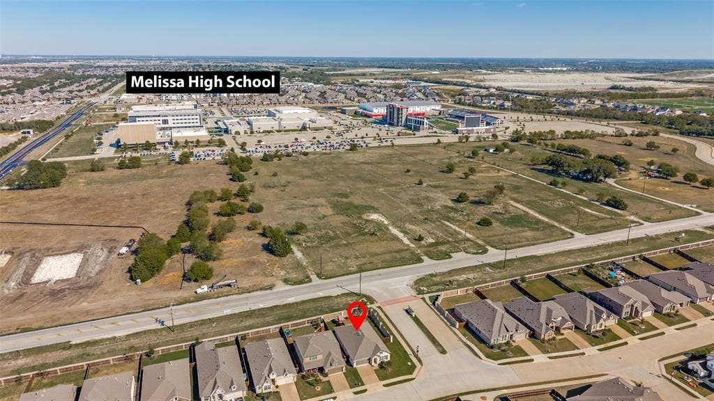 3417 Paintbrush Path, Melissa, TX 75454 Aerial perspective of a residential property featuring proximity to Melissa High School and surrounding suburban development