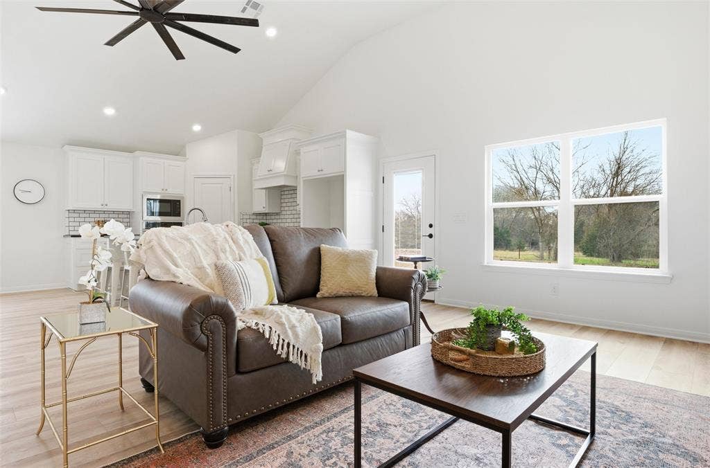 2303 Pilgrim Lane, Lorena, TX 76655 Vaulted ceilings, wood-finish flooring, recessed lighting, and a large window with exterior natural light