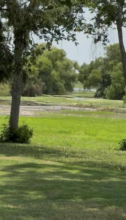 2303 Pilgrim Lane, Lorena, TX 76655 Expansive grounds featuring mature shade trees, established lawn, and open natural landscape