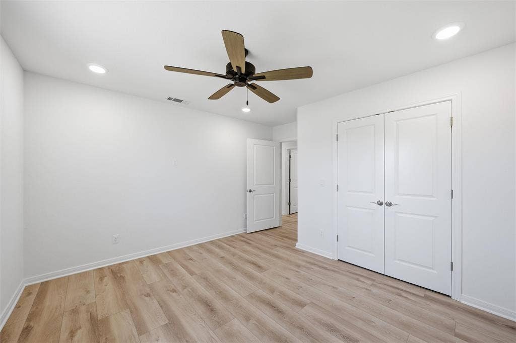 2303 Pilgrim Lane, Lorena, TX 76655 Room featuring wood-finish flooring, recessed lighting, a ceiling fan with integrated lighting, and dual-panel closet doors