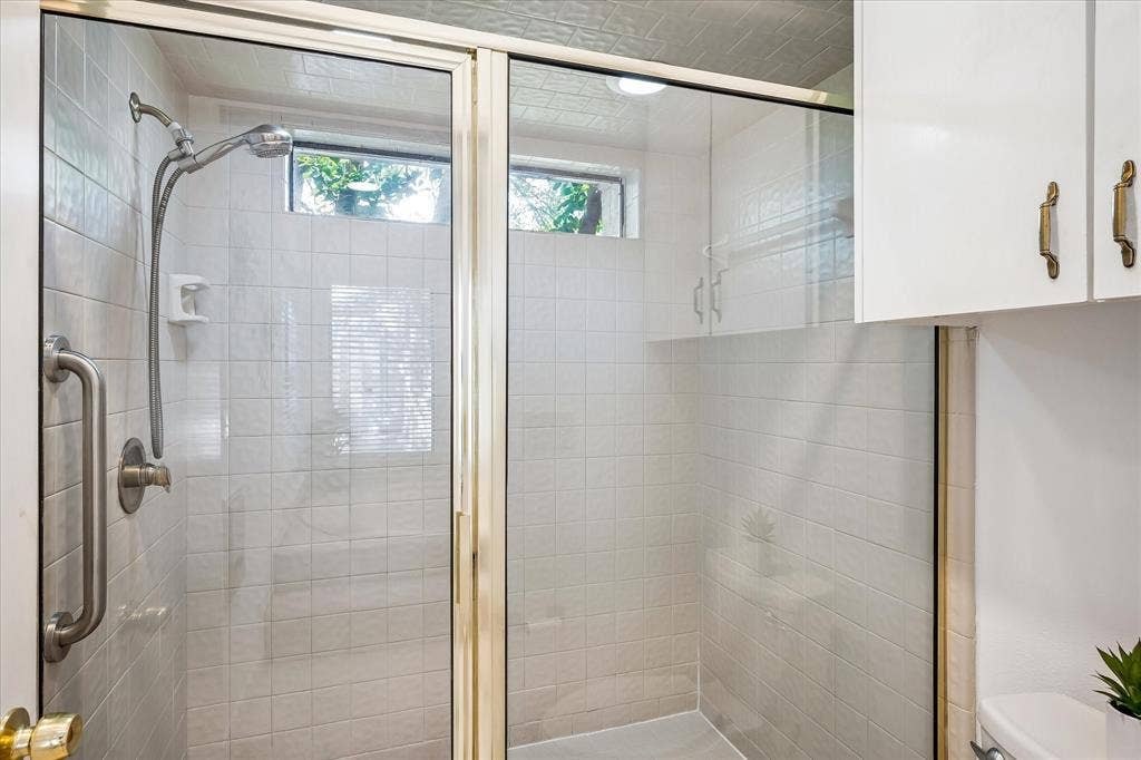 2926 N Saint Andrews Drive, Richardson, TX 75082 Primary bathroom has a large walk-in shower.