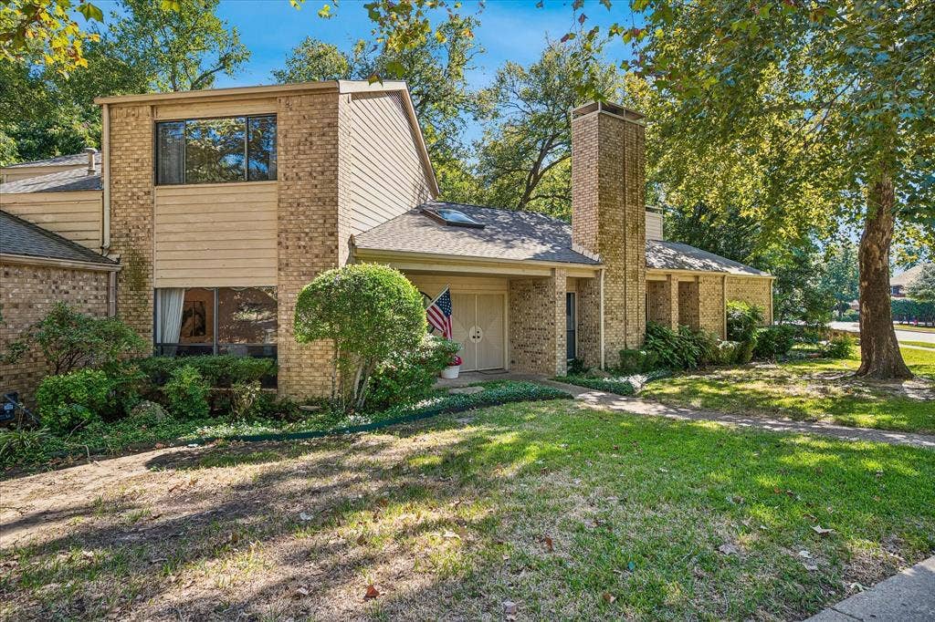2926 N Saint Andrews Drive, Richardson, TX 75082 Another view of the front of the home shows large windows and skylights brining plenty of natural light into the home.