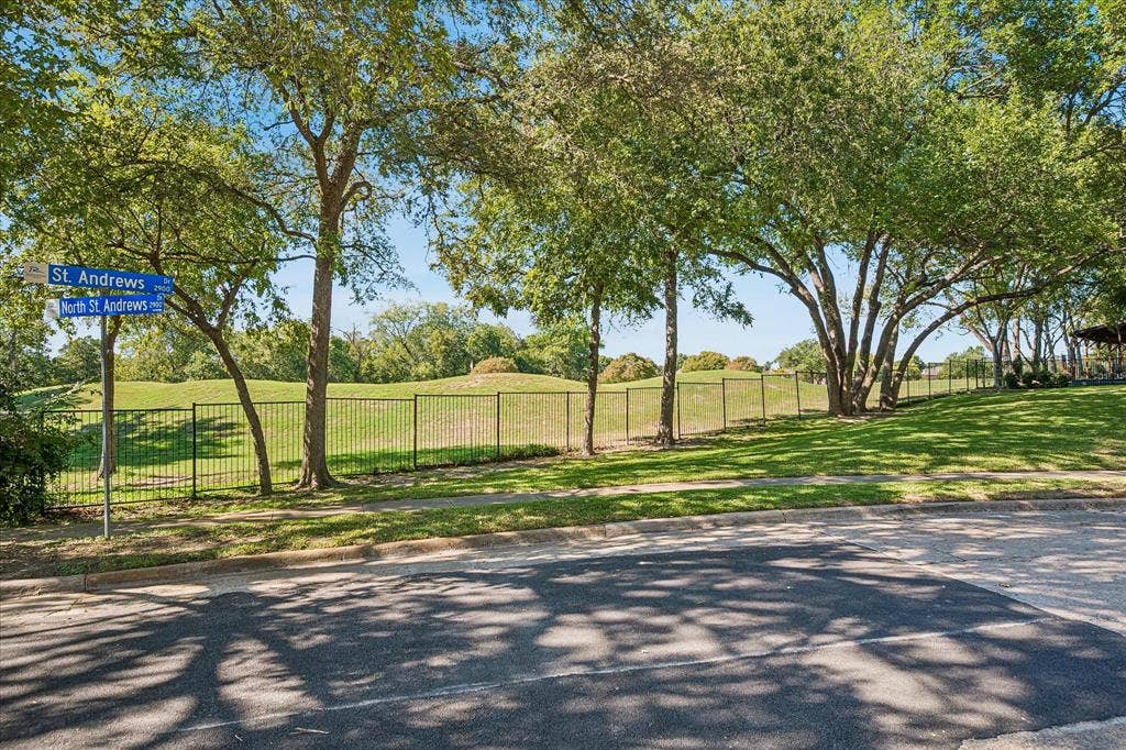 2926 N Saint Andrews Drive, Richardson, TX 75082 A view across the street of Sherrill Park golf course hole #7 green on Course #1. The golf course is a wonderful asset to have so close in the neighborhood.