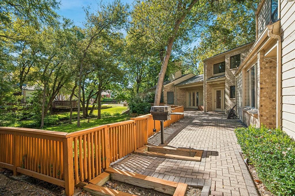 2926 N Saint Andrews Drive, Richardson, TX 75082 Another view of the backyard paved deck with a built-in gas grill. Plenty of space to entertain and enjoy nature and wildlife from your backyard.