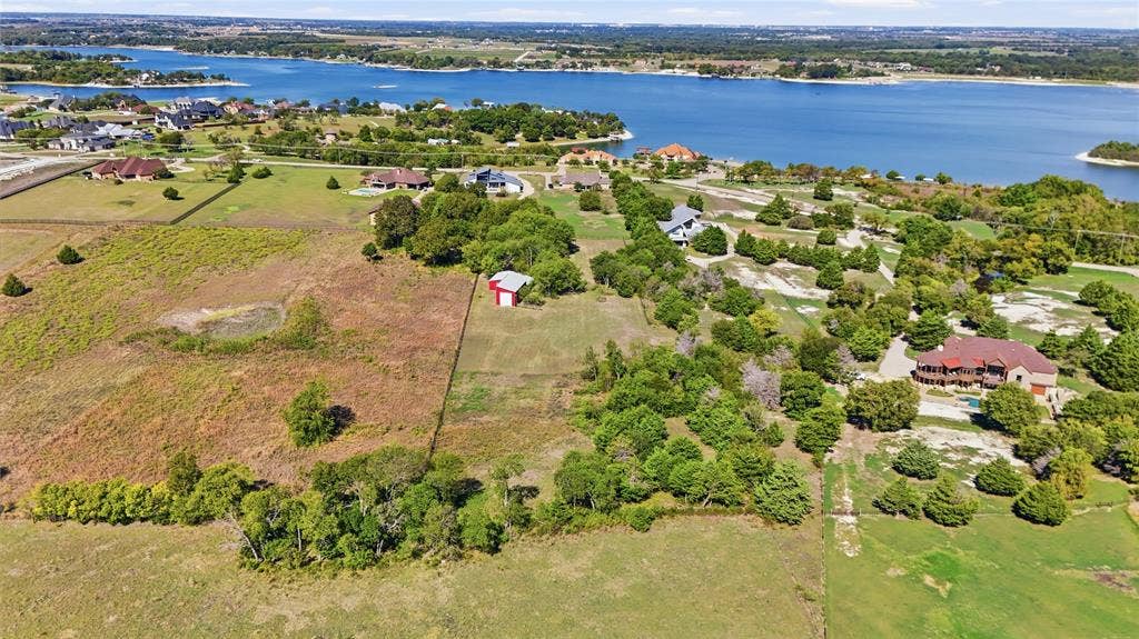 211 Hunter Pass, Waxahachie, TX 75165 Expansive acreage featuring mature trees, a detached structure, and proximity to the shoreline