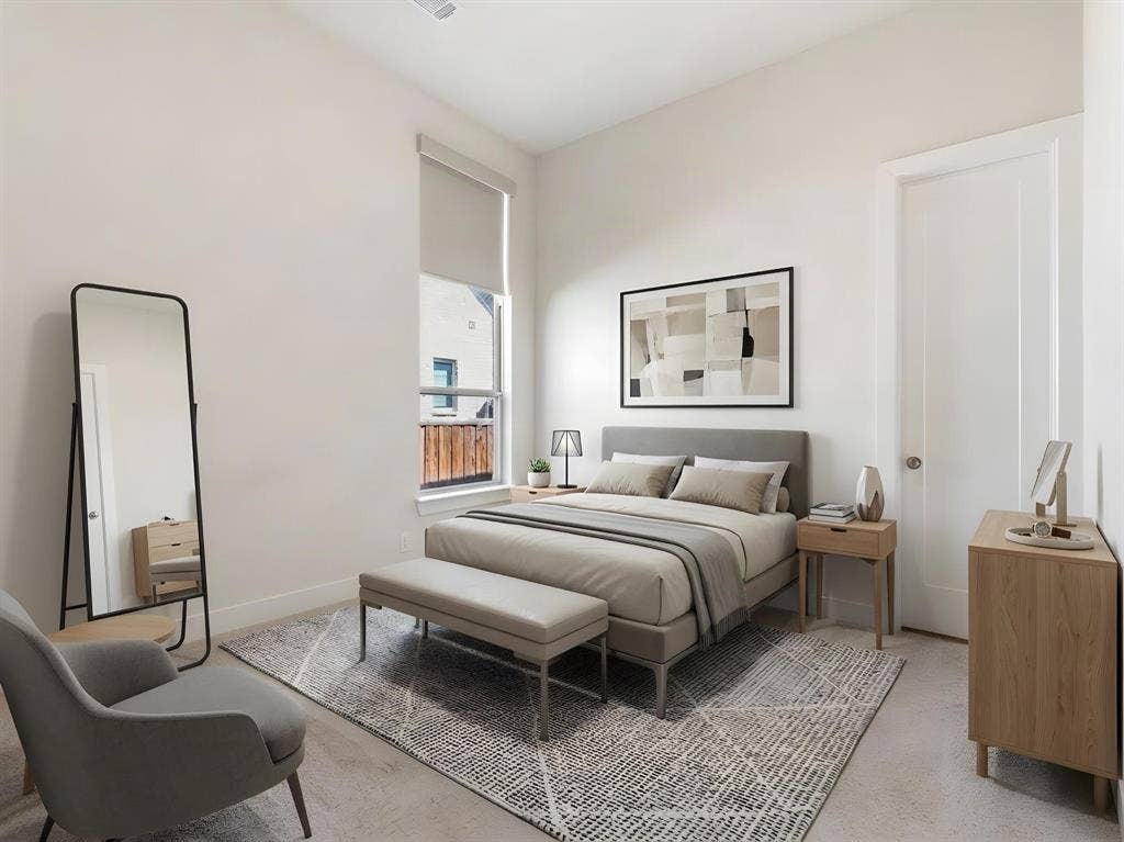 High ceilings, neutral wall palette, single-panel interior door, and tall window with roller shade