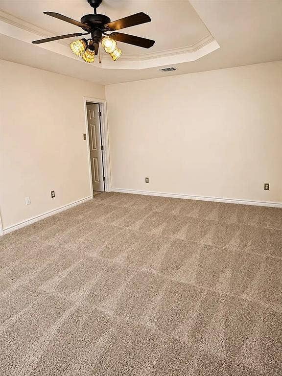 1207 Fox Trail Drive, Allen, TX 75002 Interior space featuring a recessed tray ceiling, wall-to-wall carpeting, and a central ceiling fan with integrated multi-light fixture
