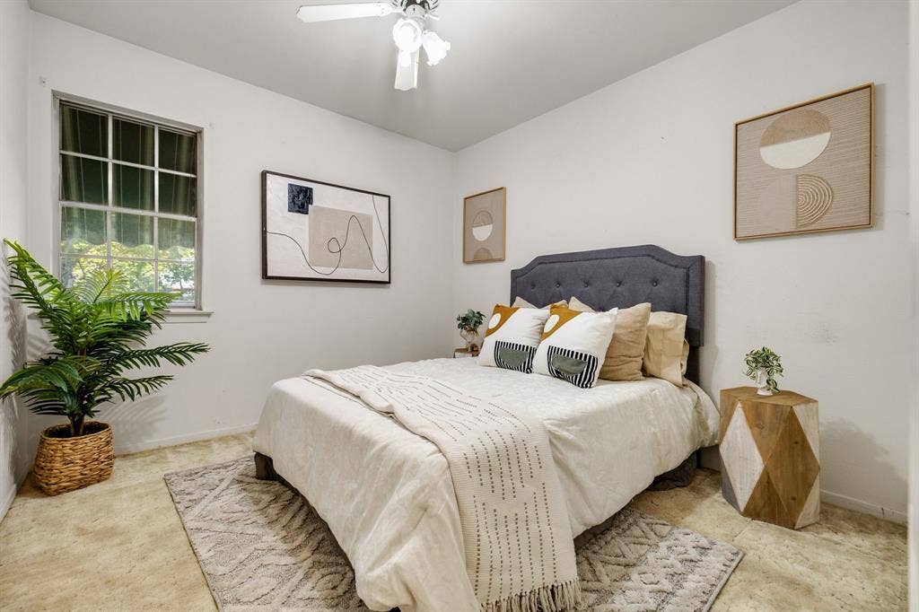 3209 Sheffield Street, Irving, TX 75062 Bedroom featuring neutral-toned carpeting, a multi-pane window, and a ceiling-mounted light fixture with a fan