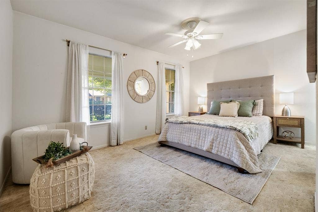 3209 Sheffield Street, Irving, TX 75062 Neutral wall-to-wall carpeting, multiple windows providing natural light, and a central ceiling fan with integrated lighting