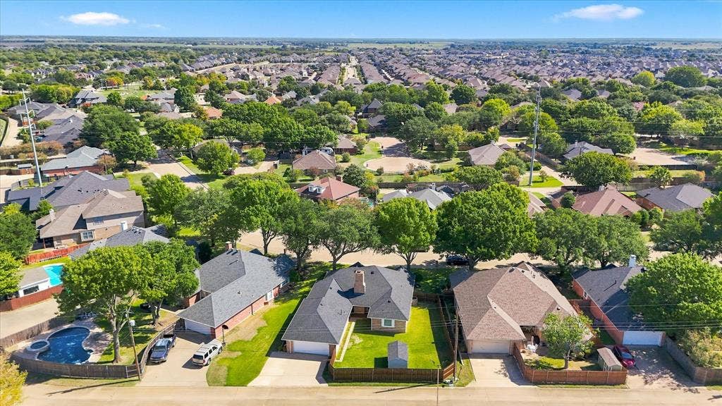 210 Santa Fe Trail, Waxahachie, TX 75165 Aerial perspective featuring residential lots with established mature trees, manicured lawns, and varied rooflines