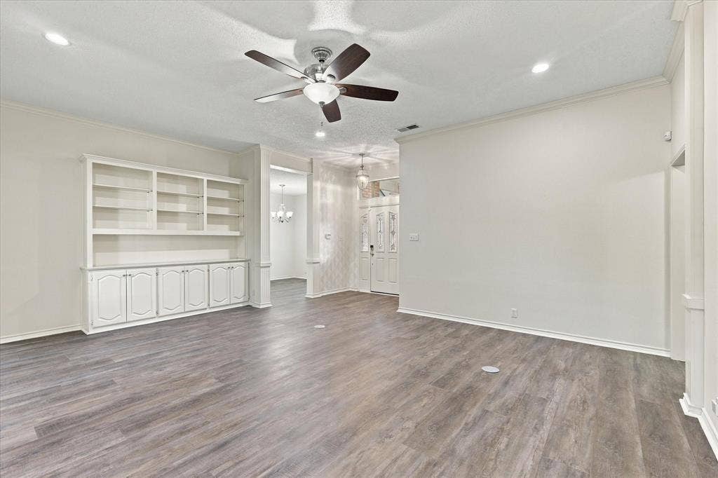 210 Santa Fe Trail, Waxahachie, TX 75165 Interior space featuring wood-finish flooring, built-in cabinetry with glass shelving, recessed lighting, and a multi-blade ceiling fan