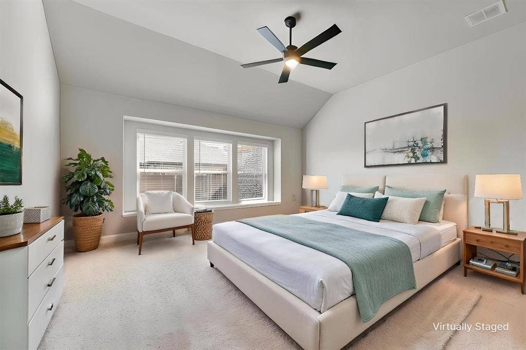 208 Shady Bank Way, Nevada, TX 75173 Vaulted ceilings featuring a black multi-blade ceiling fan and a triple-pane window alcove