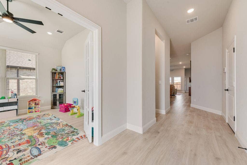 208 Shady Bank Way, Nevada, TX 75173 Wood-finish flooring, recessed lighting, ceiling fan with matte black finish, and French doors featuring multi-pane glass inserts