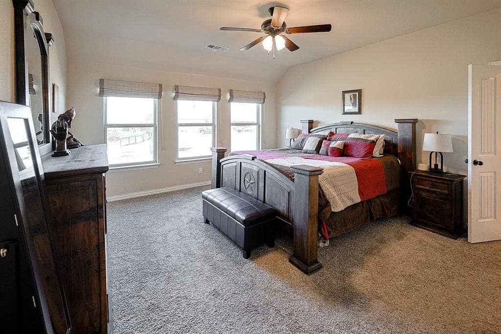 2828 Luke Drive, Farmersville, TX 75442 Vaulted ceiling, three picture windows, and a ceiling fan with integrated lighting