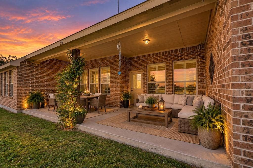 2828 Luke Drive, Farmersville, TX 75442 Covered concrete patio featuring full-brick exterior walls, recessed ceiling lighting, and multiple window placements
