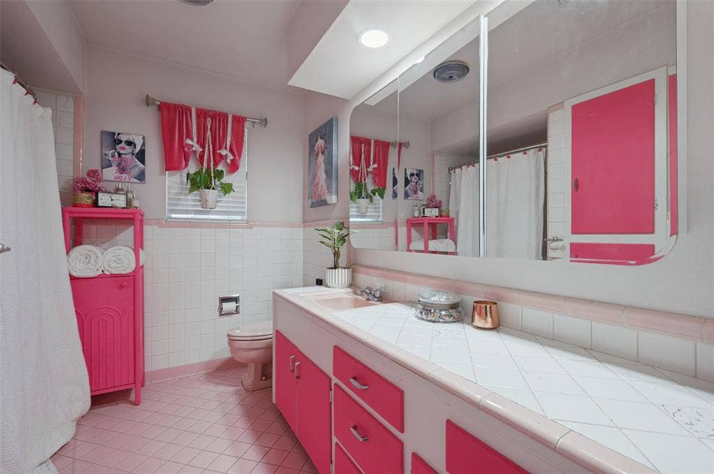 5307 Moneta Lane, Dallas, TX 75236 The full bathroom is accessible from the hallway and has a shower/tub combo, lots of cabinets, and a long counter.