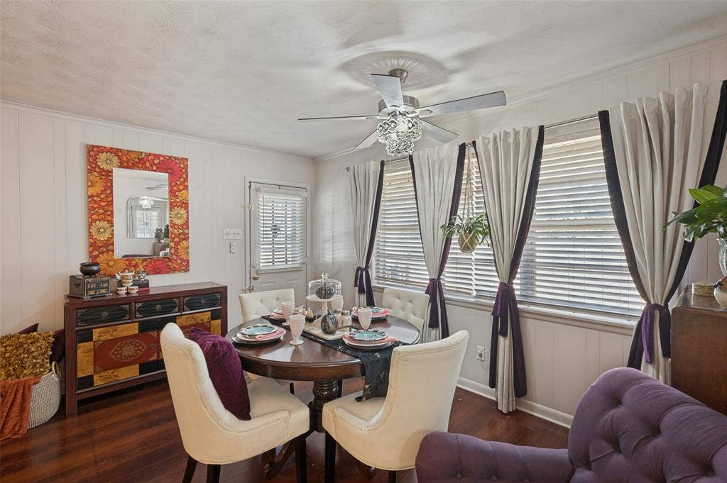5307 Moneta Lane, Dallas, TX 75236 The dining space has a decorative chandelier fan, window coverings, and easy access to the back patio.